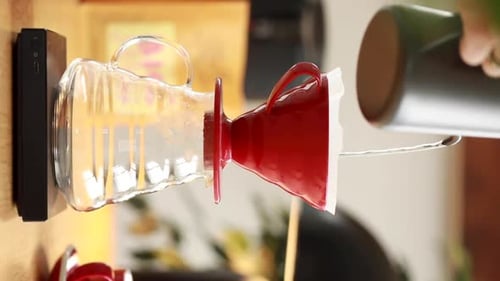 Pouring Water into Coffee Pour-Over at Home