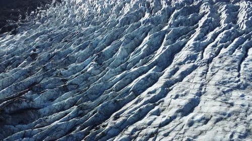 Aerial Top View Glacier in Iceland Pure Arctic Nature with Blue Ice and White Snow at Magical Winter