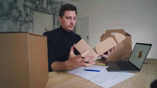 Designer Works Develops Packaging Design Using Computer and Drawing