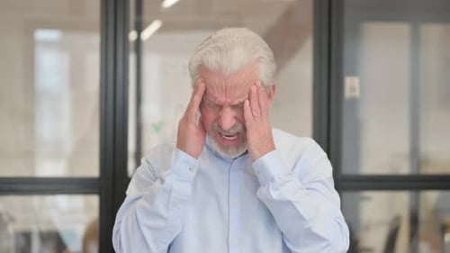 Portrait of Senior Old Businessman with Headache in Office