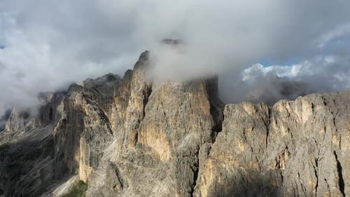 Aerial View of Dolomites Mountain Peaks Shrouded in Clouds on a Sunny Day South Tyrol Italy