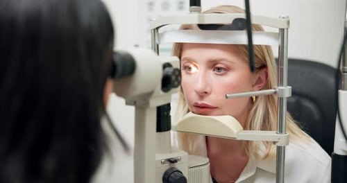 Ophthalmology, woman and machine with laser for eye exam with vision test