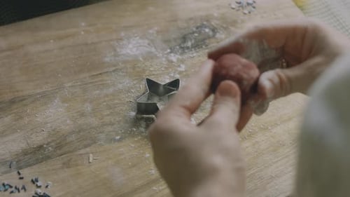 Hands Making Star-Shaped Cookies for Christmas Dessert