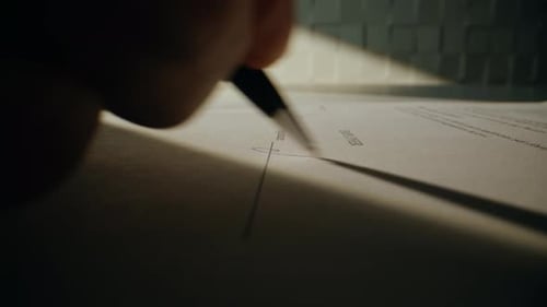 Signing a Contract with a Pen Close Up