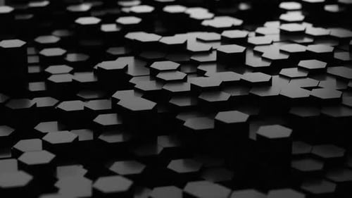 Dynamic black hexagons shifting in low key lighting create a modern