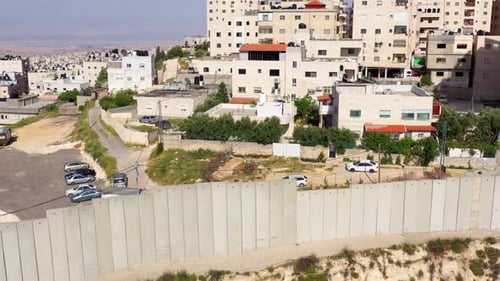 Security wall with Israeli idf watch tower Close to Shuafat Refugee Camp- Aerial