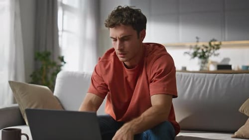 Serious Man Typing Laptop at Room Closeup Tired Freelancer Feeling Exhausted