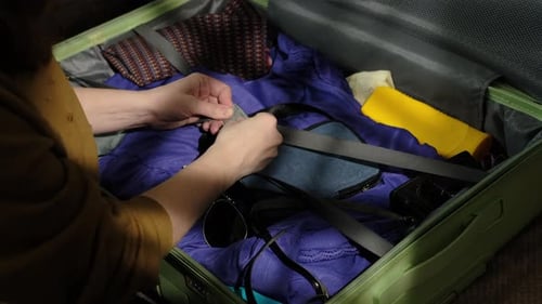 Woman Packing a Suitcase for a Trip
