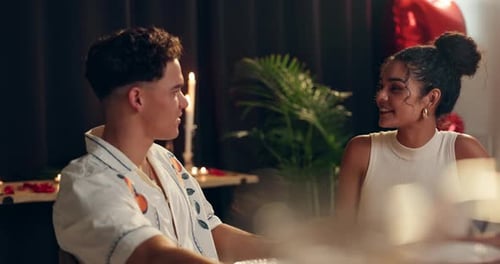 Happy, couple and laughing on date at restaurant for romance, valentines day celebration