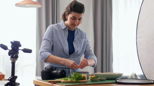 Woman adds ingredients to bowl for food photography