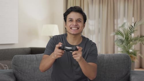 Indian man playing video games