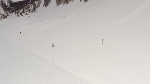 Aerial view of People Skiing and snowboarding on hill, Ski Resort.