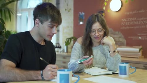 Young Adults Collaborating on Project Indoors