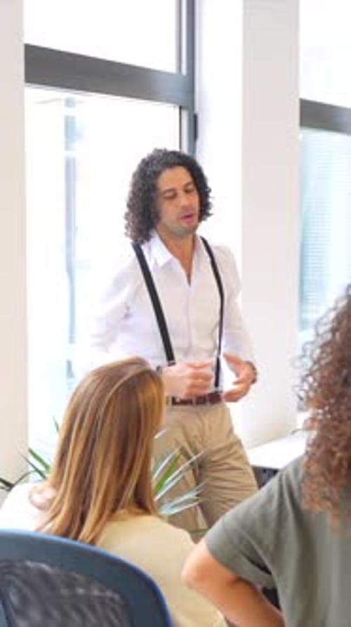 People Meeting in Office Listening to Presentation