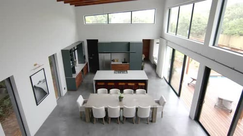 High angle view of open plan living room, dining room and kitchen, copy space, slow motion