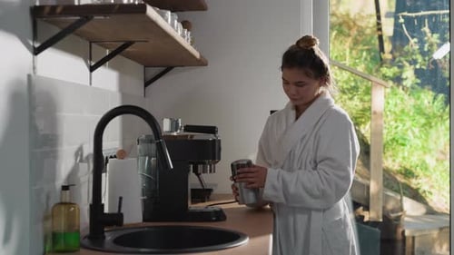 Woman in Robe Making Coffee at Home