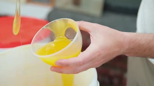 Honey Dripping Dipping Honey with Honey Wooden Spoon in Plastic Jar Healthy Organic Food