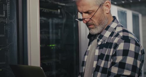 IT Professional Working on Laptop