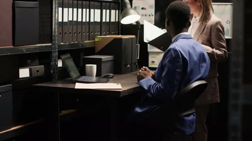 Business People Working Together in Dark Office