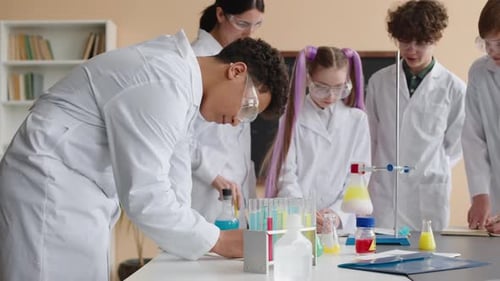 Students Do Chemistry Experiment in School Lab