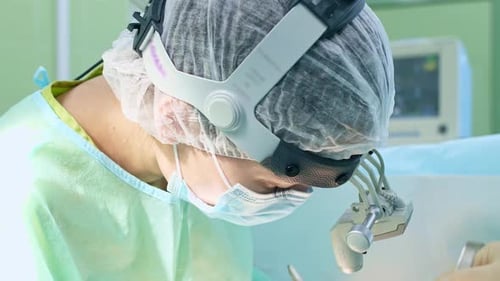Surgeon Performing Operation in Operating Room