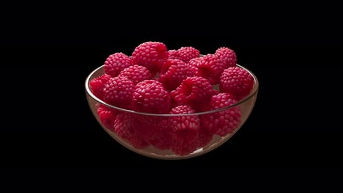 A glass vase filled with raspberries spinning in a circle. Alpha Channel.
