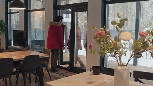 Friends Arriving at a Cozy Winter Home