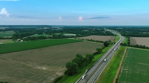 Aerial View of Highway Through Green Countryside