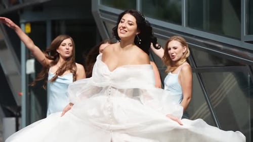 Bride and Bridesmaids Celebrating in Urban Setting