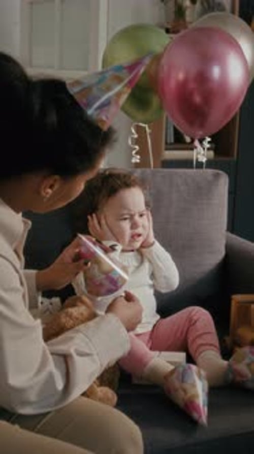 Woman and Toddler Celebrating Birthday Indoors