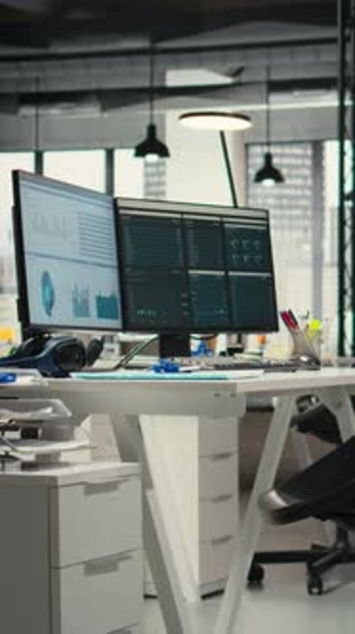 Vertical Video Empty Business Workplace Filled with Desks and Dual Monitors