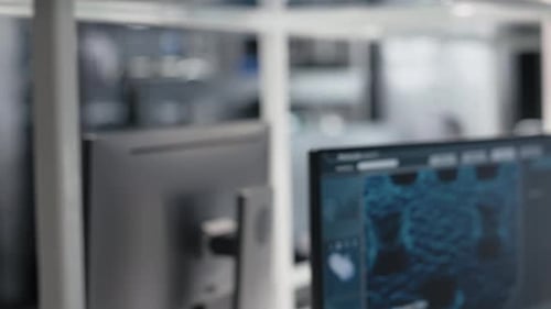Close Up of Colorful Chemical Solutions Inside Scientific Glassware on Lab Shelf