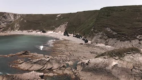 Aerial View of a Cape with a Beautiful Beach in Northern Spain