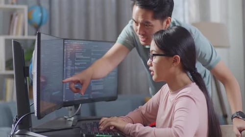 Asian Teen Girl Students Studying Software Code From Male Teacher Or Father