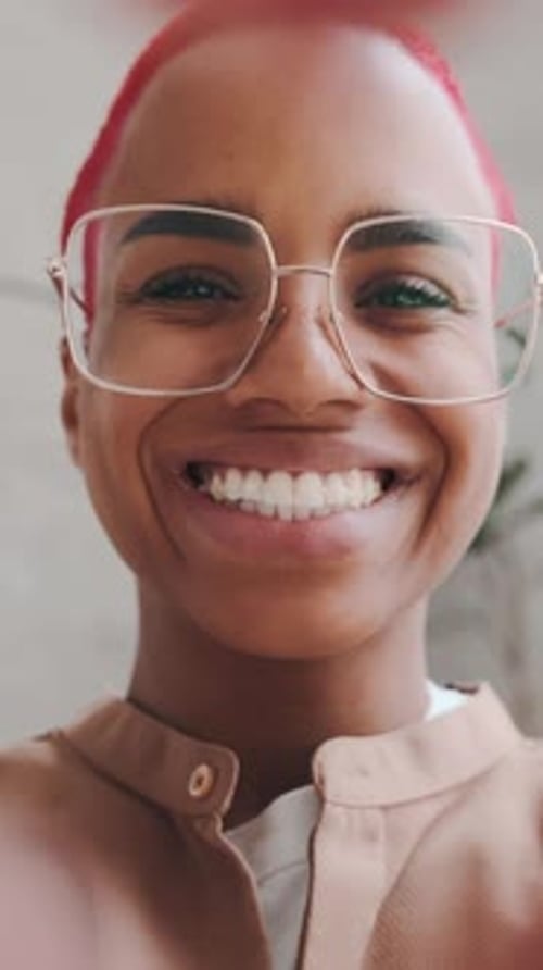 Woman Smiling Making Heart Shape with Hands