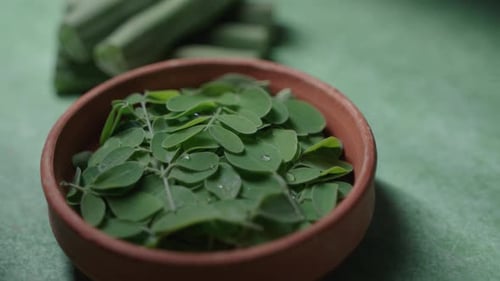 Close Up of Moringa Leaves in Bowl