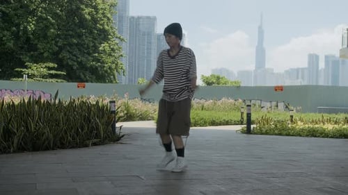 Young Adult Dancing in Urban Park