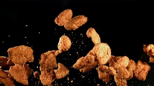 Crispy Fried Chicken Falling in Slow Motion