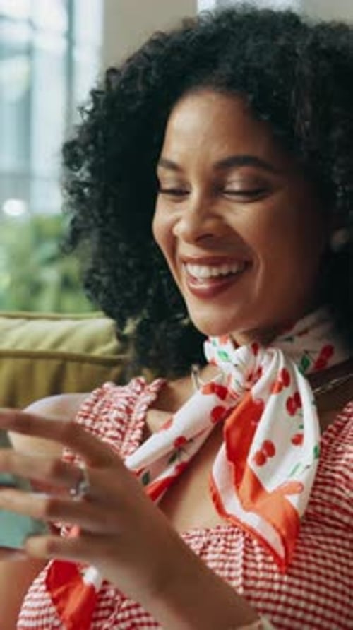 Smiling Woman Using Mobile Phone Indoors