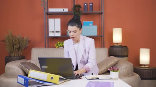 Home office worker young woman is sick and coughing.