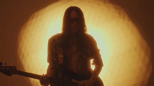 Rock Musician Playing the Guitar during Performance in Studio