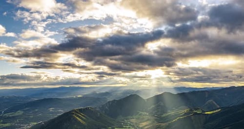 Majestic Mountains at Sunrise with Sun Rays