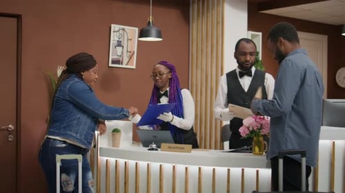 Woman Checking Into Modern Hotel