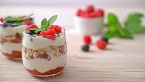 homemade raspberry and blueberry with yogurt and granola - healthy food style