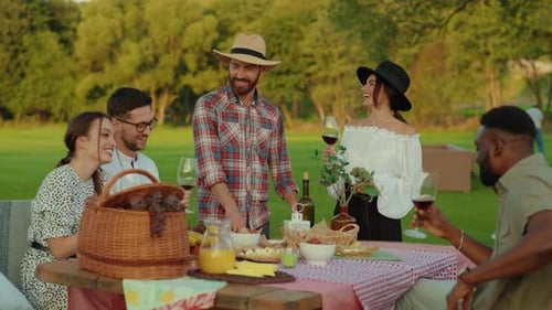 Friends Gather for Summer Picnic Outdoors