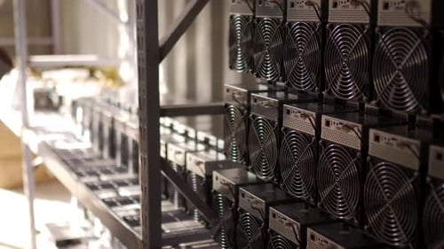 Loader Brings in Bitcoin ASIC Miners to Steel Shipping Container Warehouse Mover Puts Down Mining