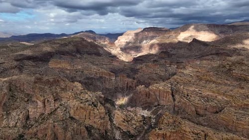 Aerial view of rock formations and canyon in desert, United States.