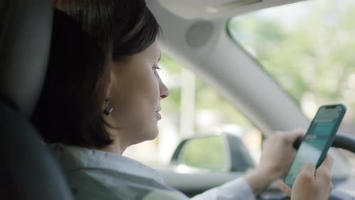 Woman Texting While Driving Distracted Driving Concept