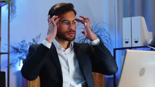 Tired Indian Business Man Suffering From Headache Problem Tension Migraine Stress at Home Office