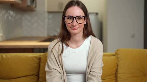 Woman With Brown Hair and Glasses Smiling